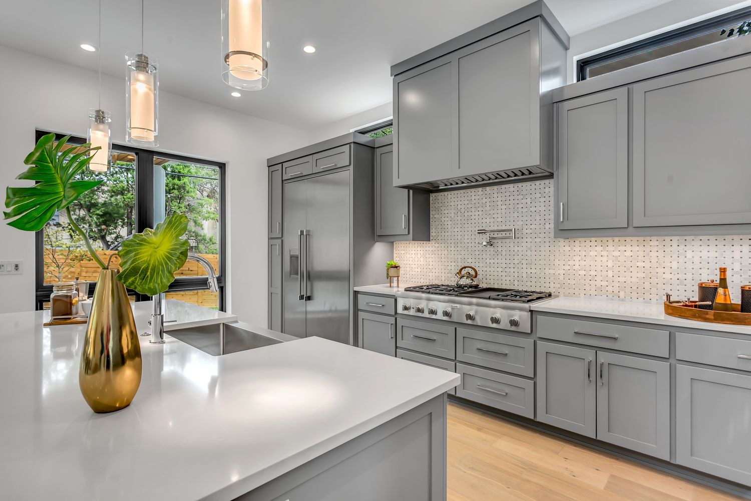 Renovated kitchen with stone counters and backsplash