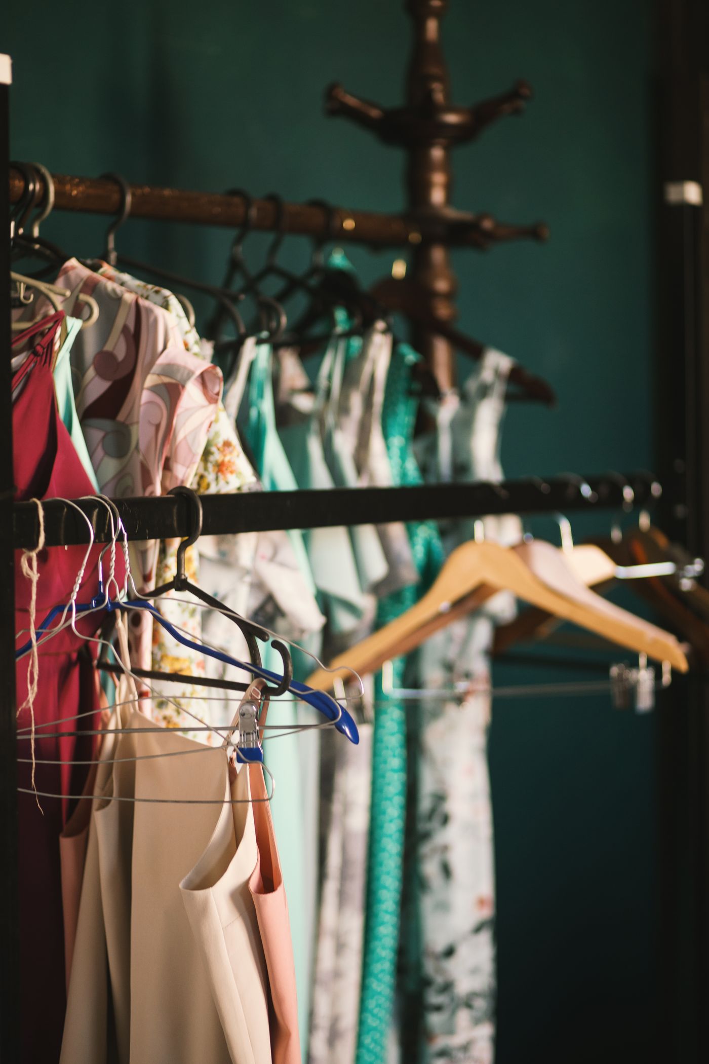 Long rack of designer fabrics in warm light