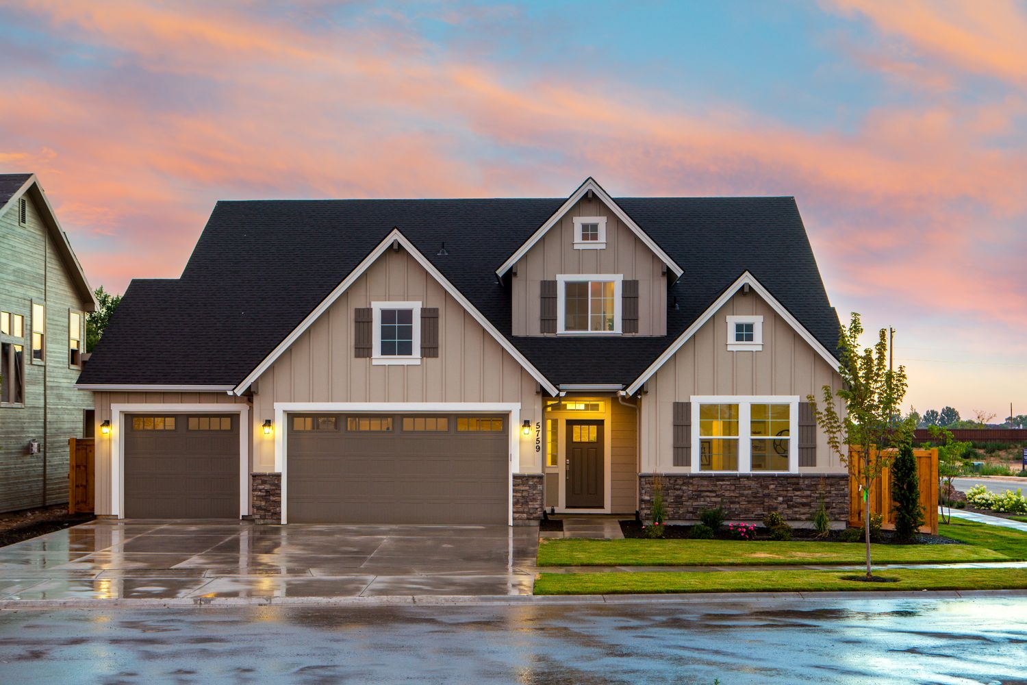 Home exterior at dusk with a clean roof