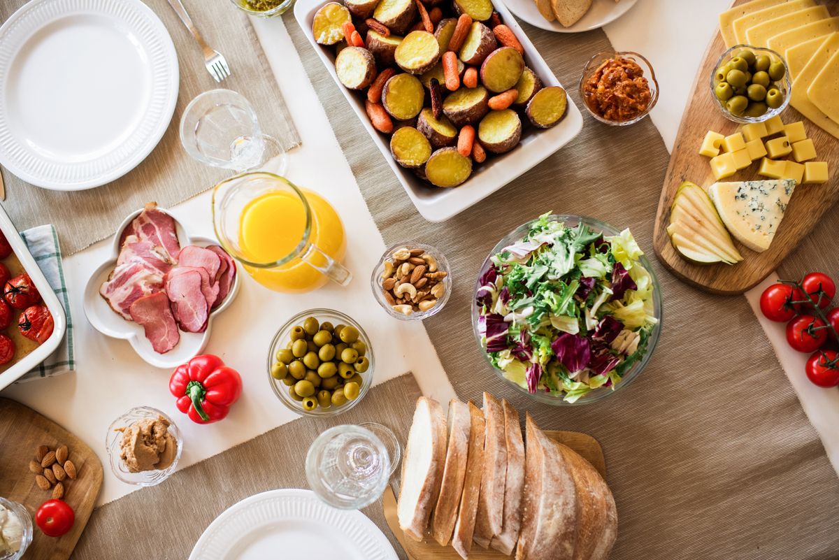 Cured meats, cheese and olives on a board