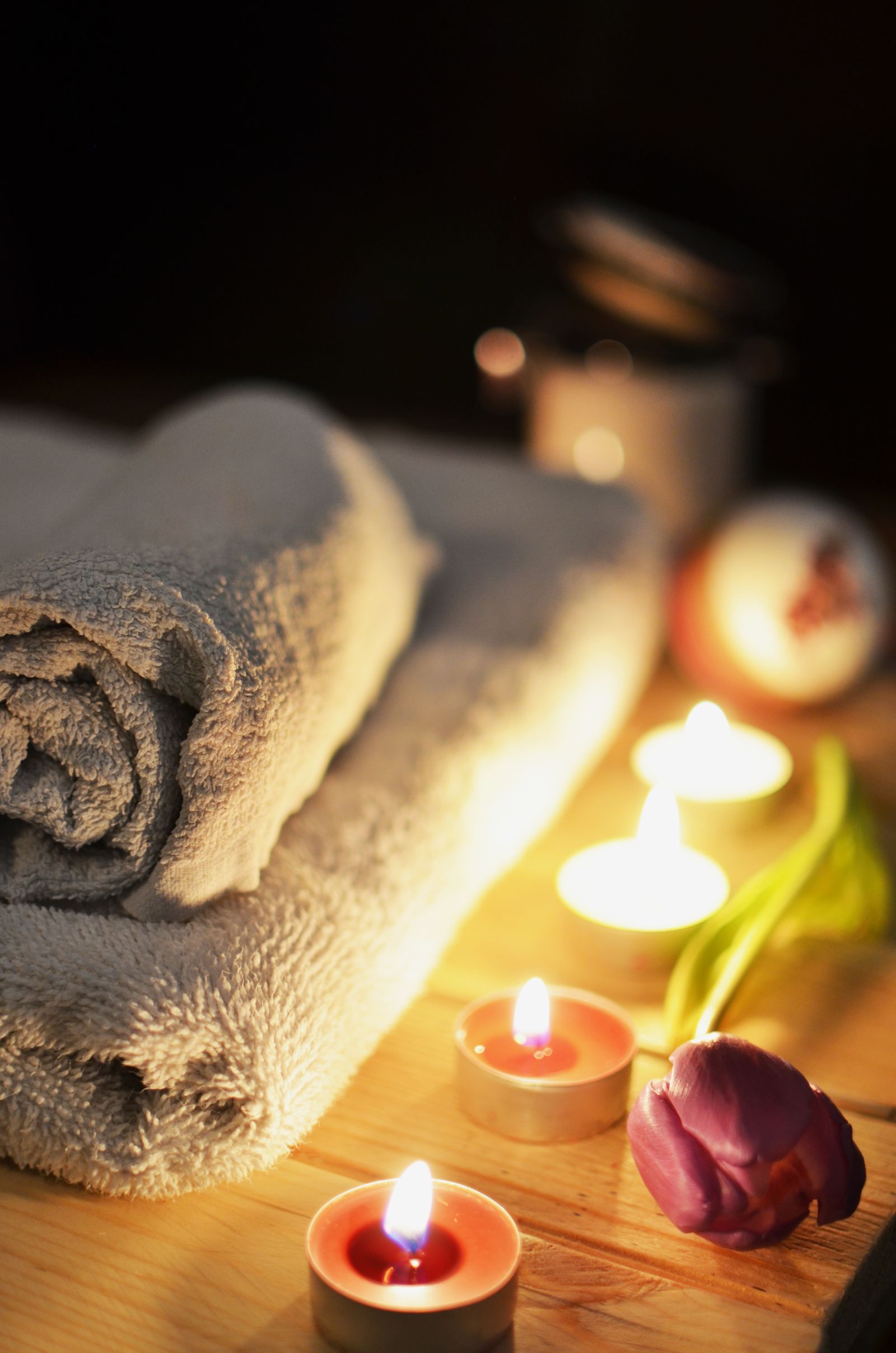Rolled towels and candlelight
