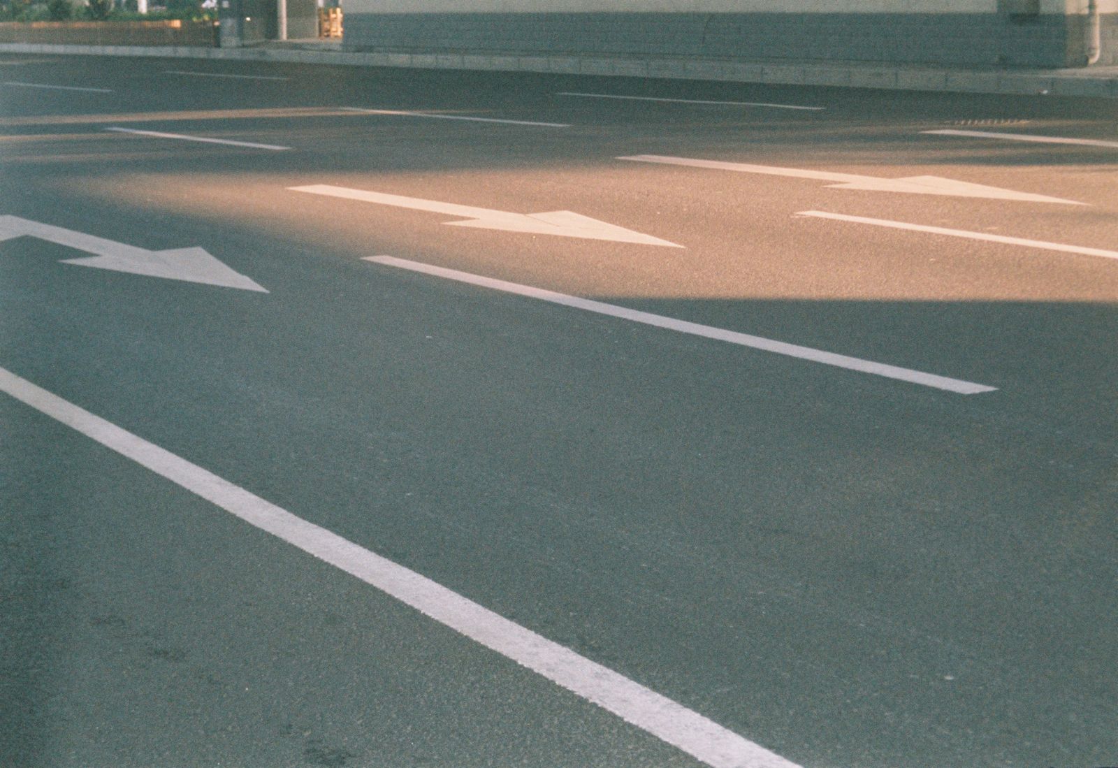 Asphalt parking surface with painted directional arrows