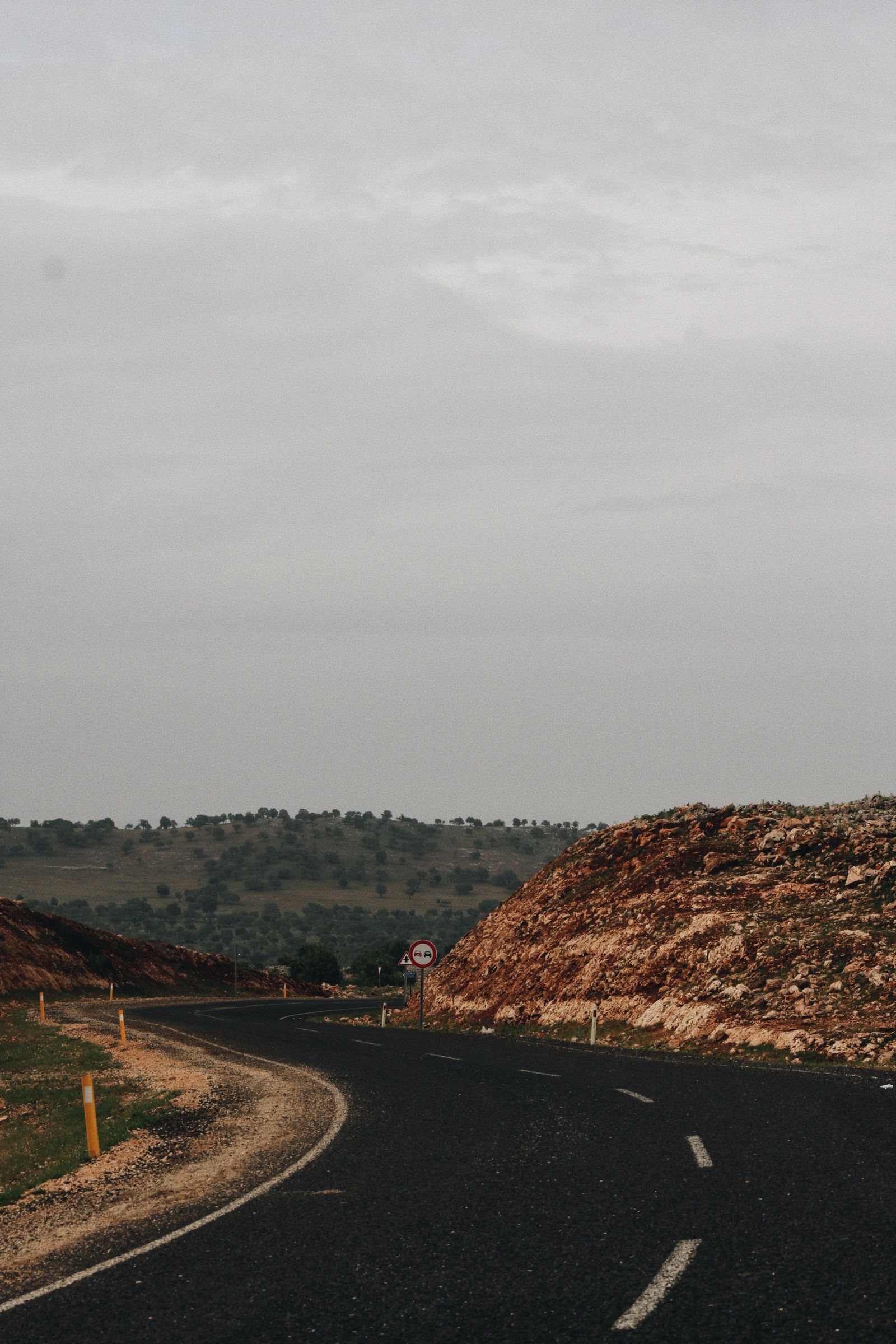 Asphalt road over rolling hills