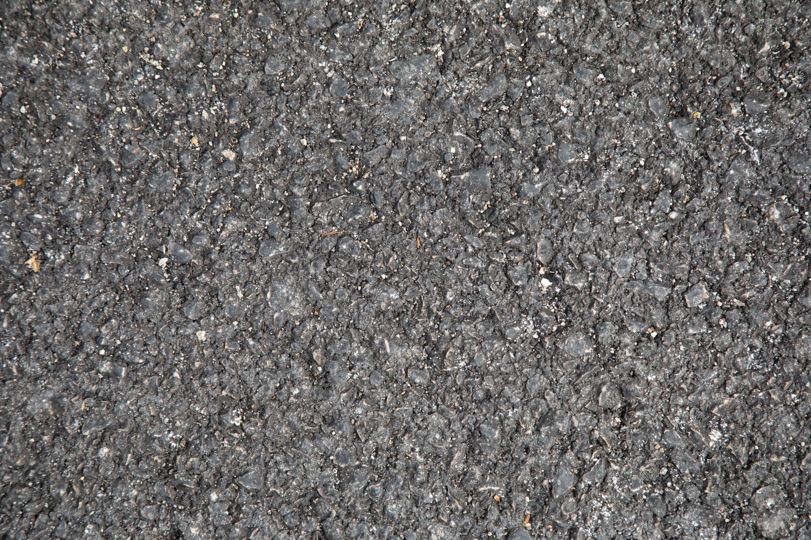 Dark asphalt texture close-up