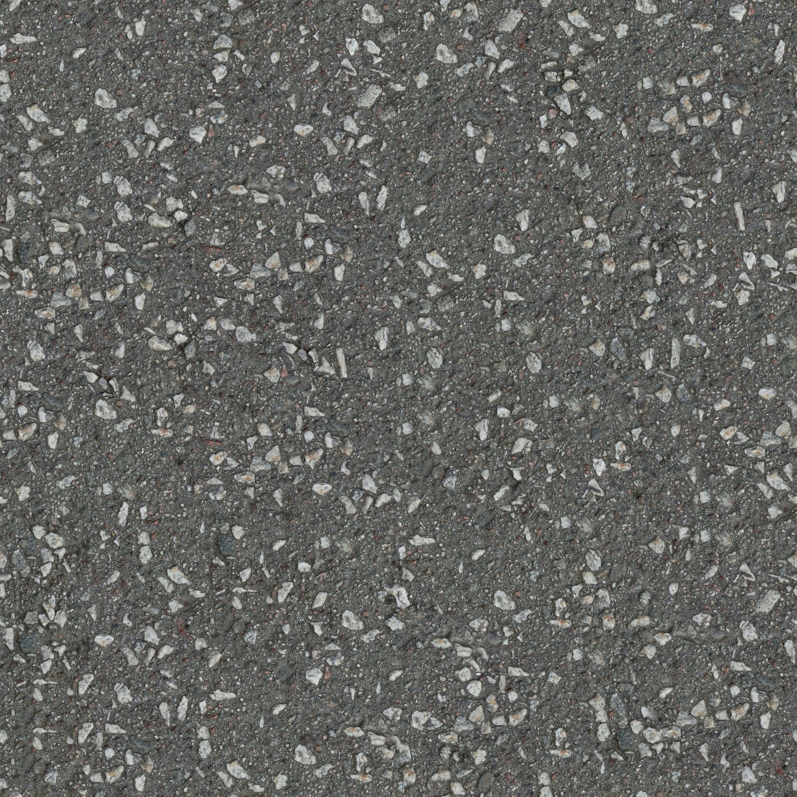Close-up of compacted asphalt surface showing aggregate stones