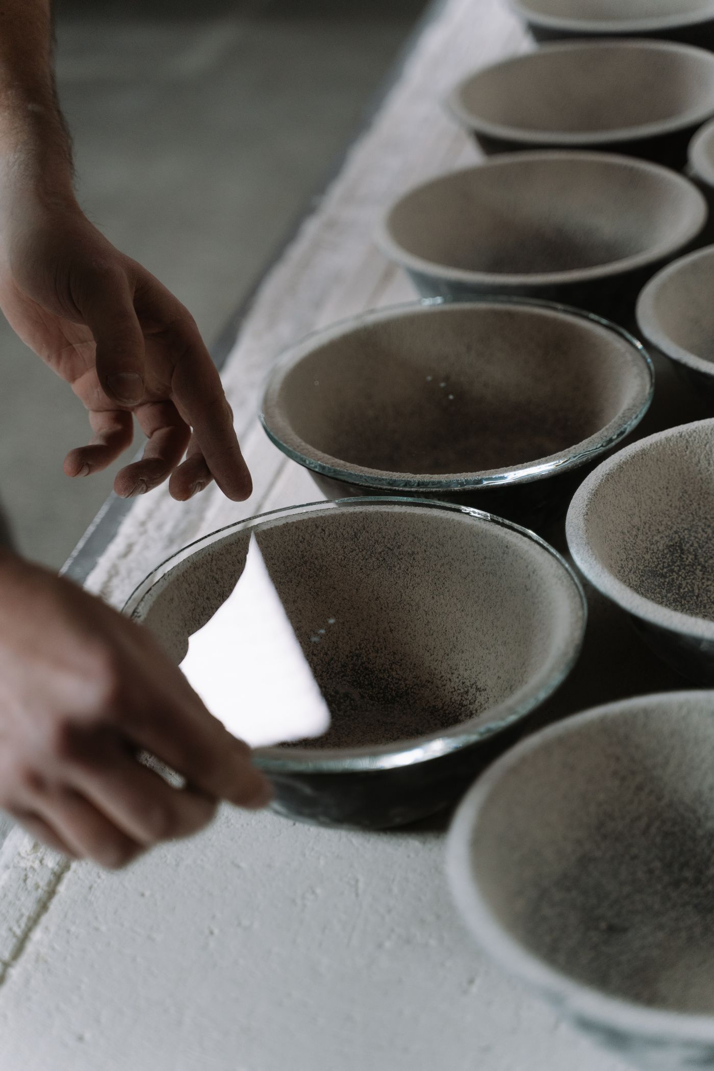Raw clay bowls drying before firing