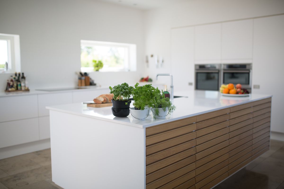 Finished kitchen with island and chrome faucet