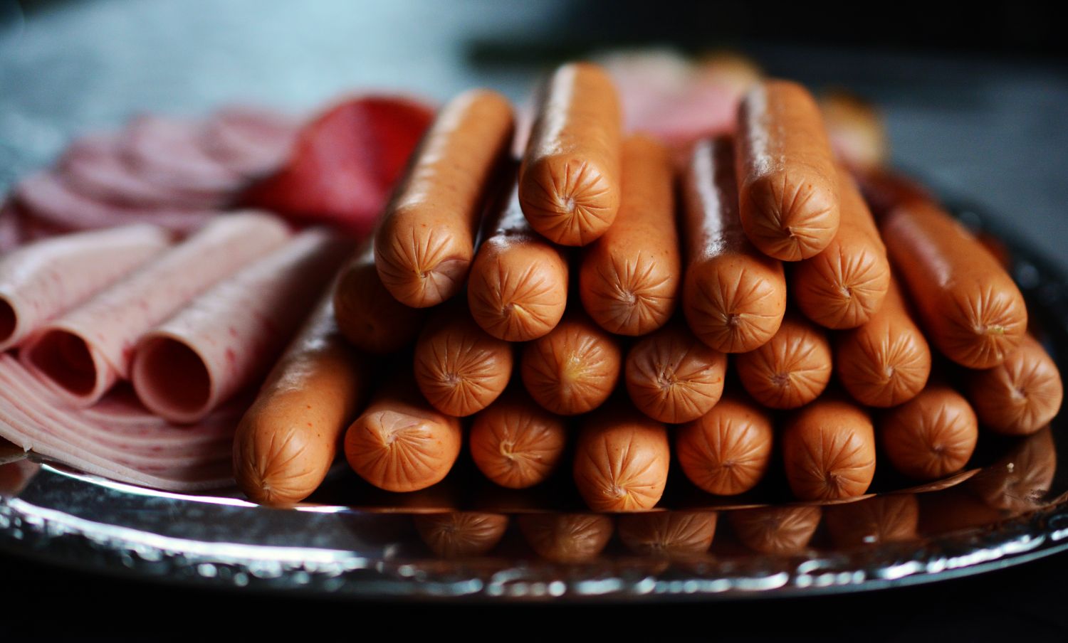Fresh sausages on a plate