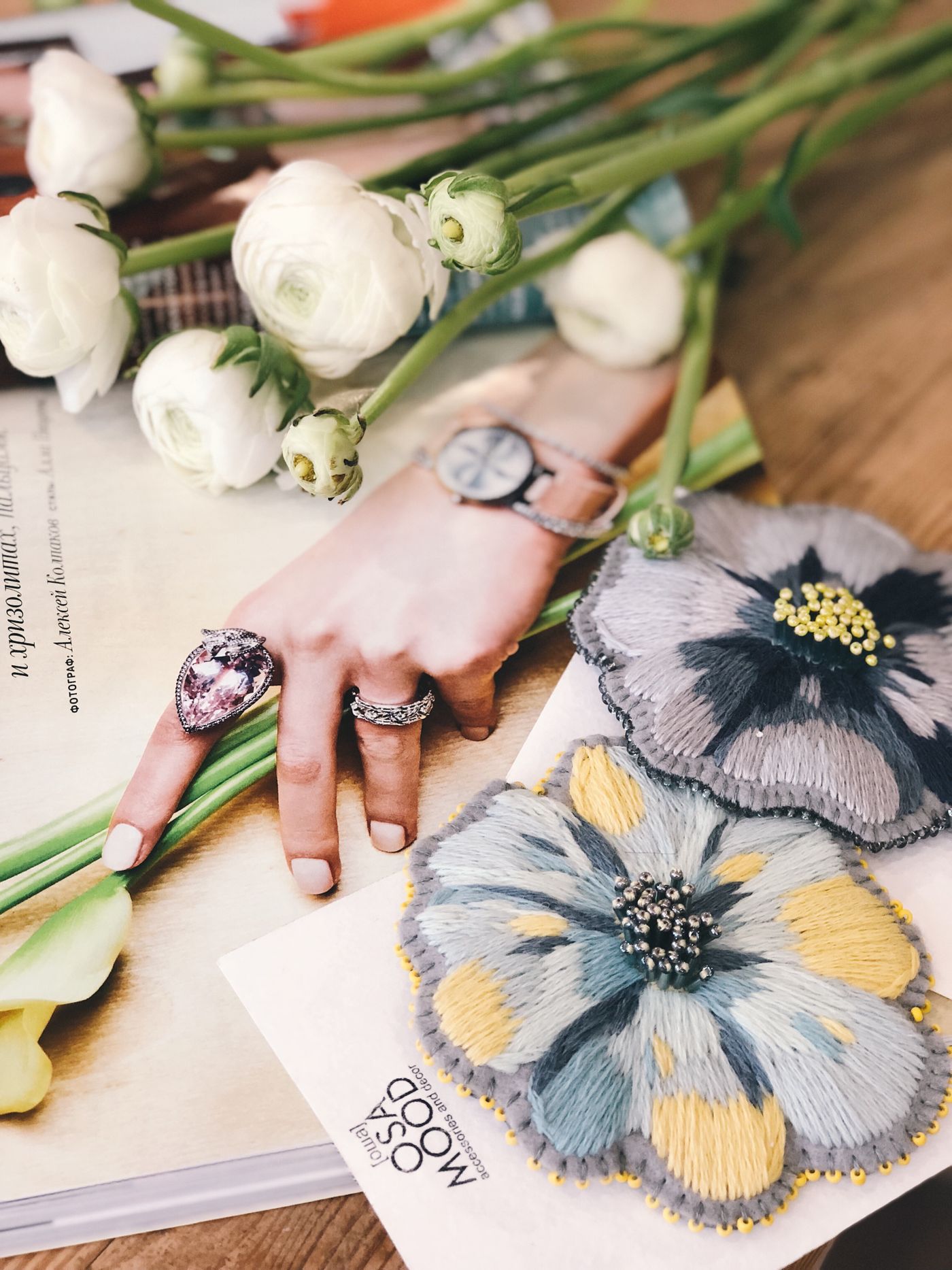 Fannie's hands at the workbench with pressed botanicals