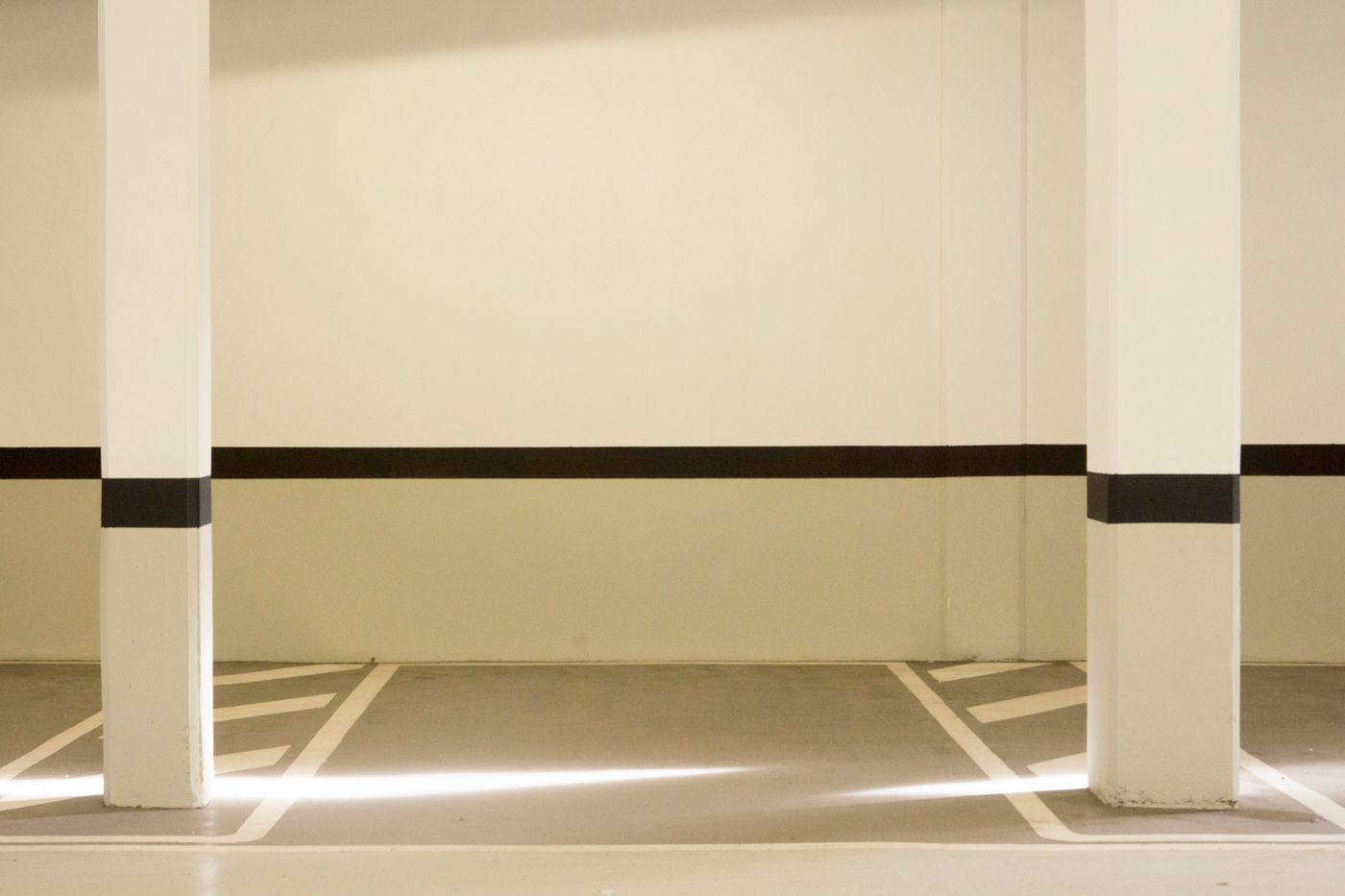 Freshly coated epoxy floor in a garage bay