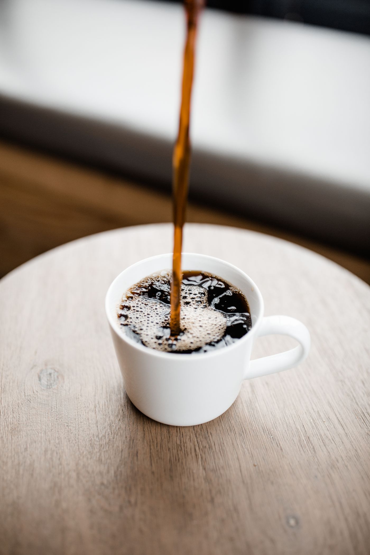 Coffee being poured into a cup