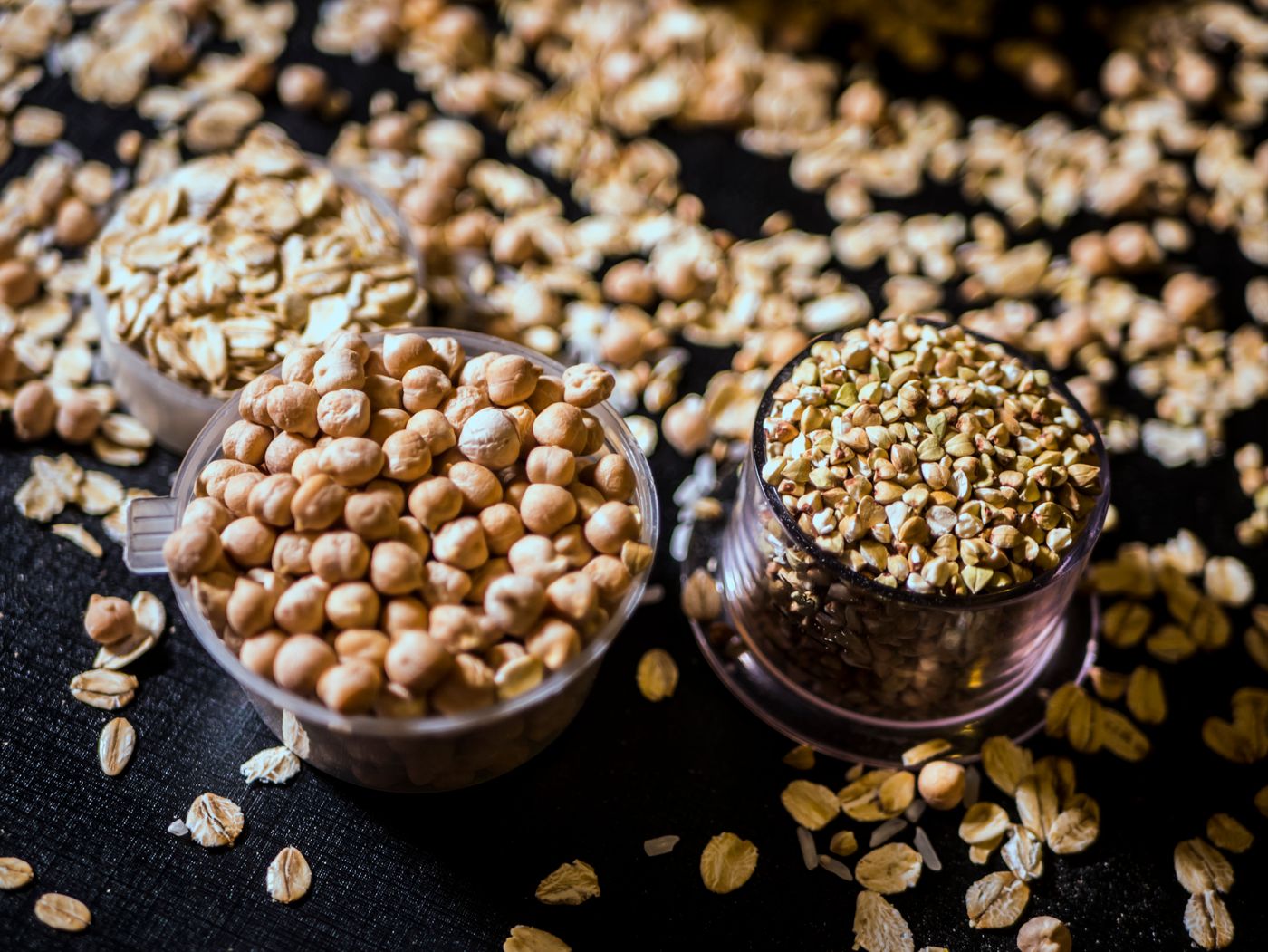 Bowls of chickpeas, oats and grains