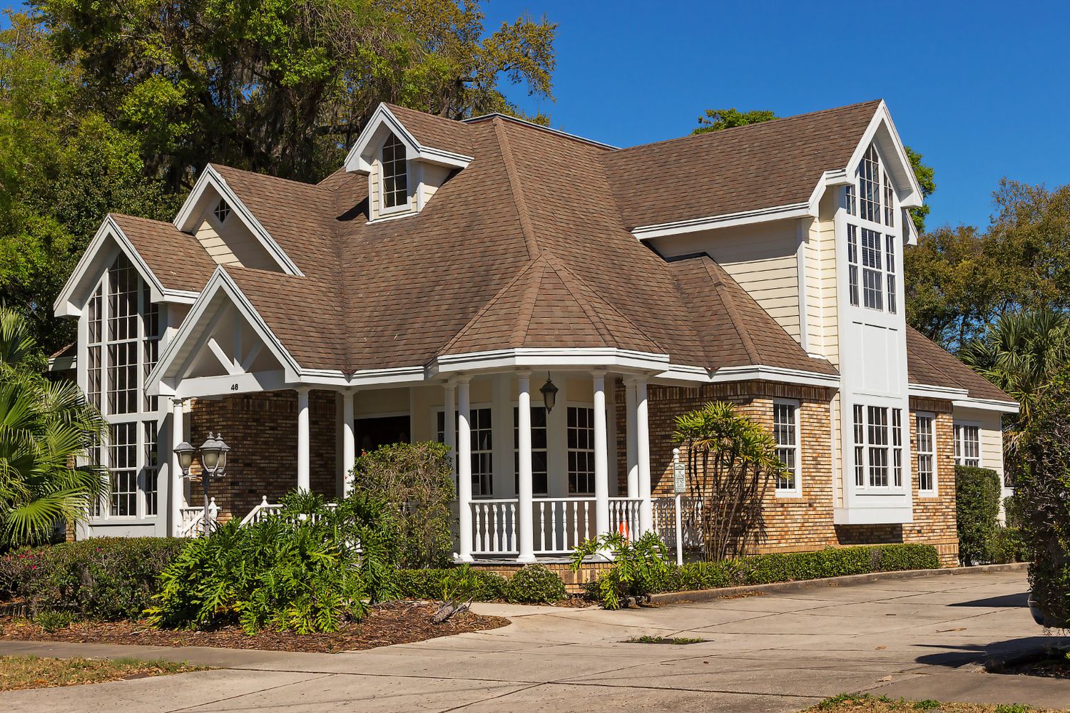 A home exterior with a clean driveway