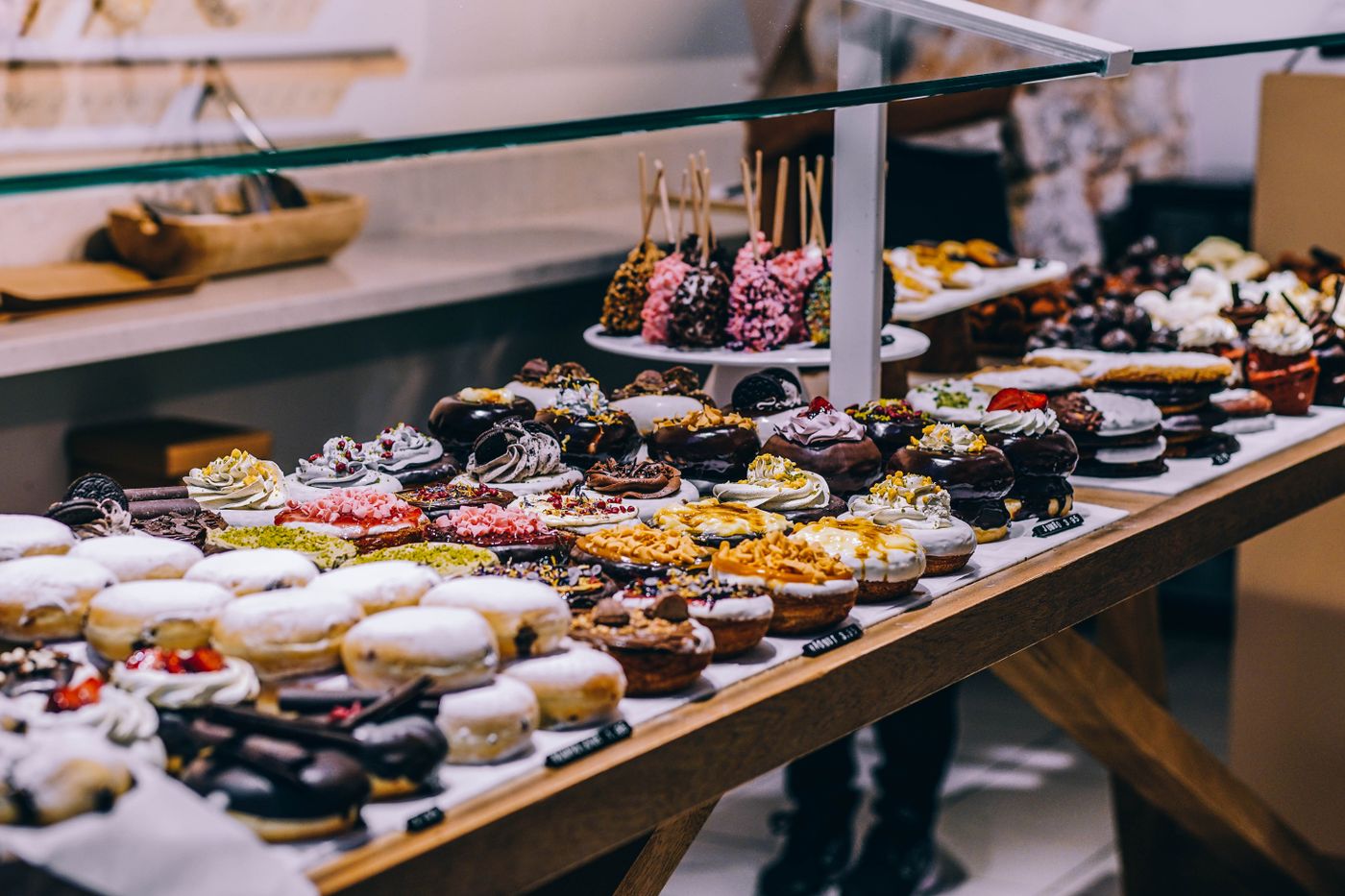 A bakery display case lined with pastries and decorated treats