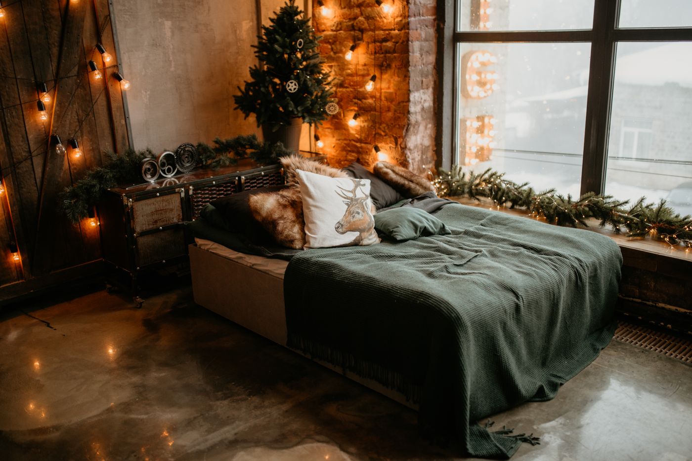 A warm studio interior — exposed brick, soft lights and an afternoon window