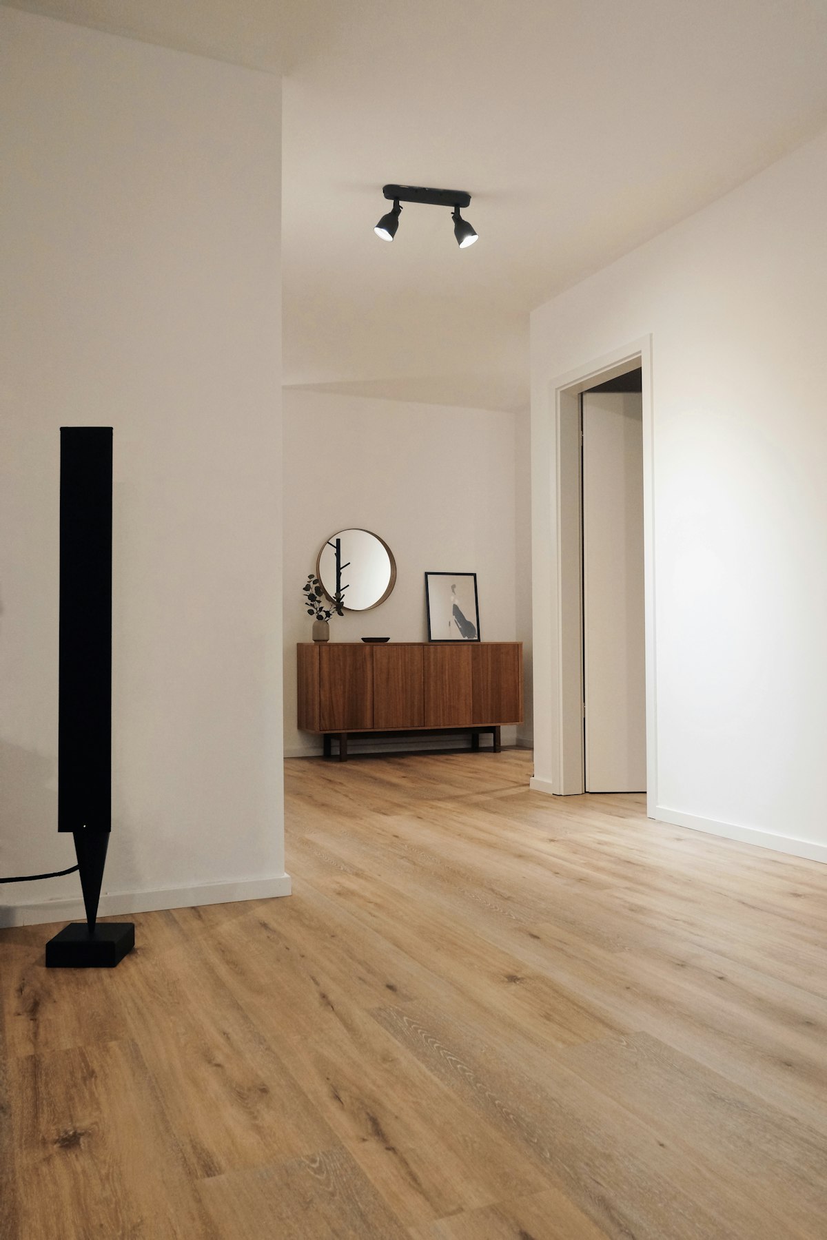 Newly installed plank hardwood flooring in a hallway