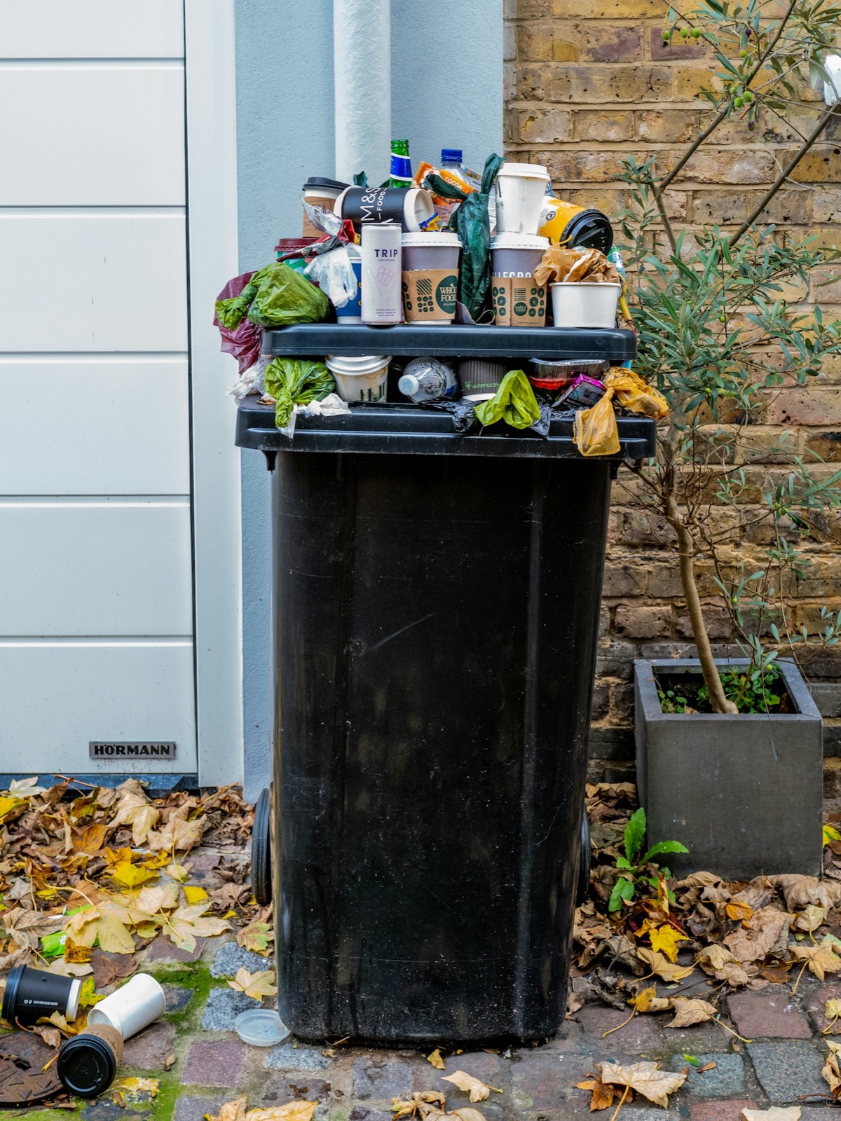Bin filled with household junk
