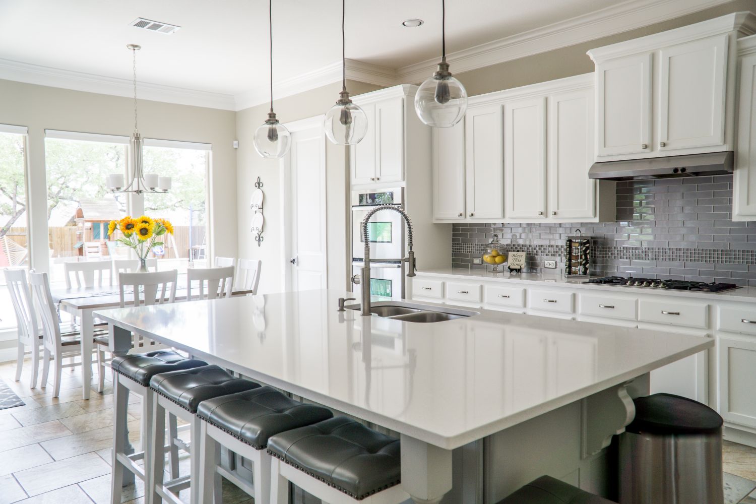 A renovated open-plan living space with custom cabinetry and island