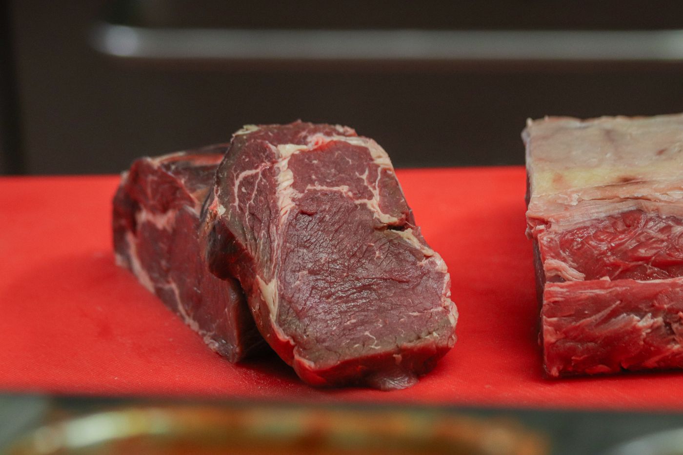 Raw marbled beef cuts on a cutting board