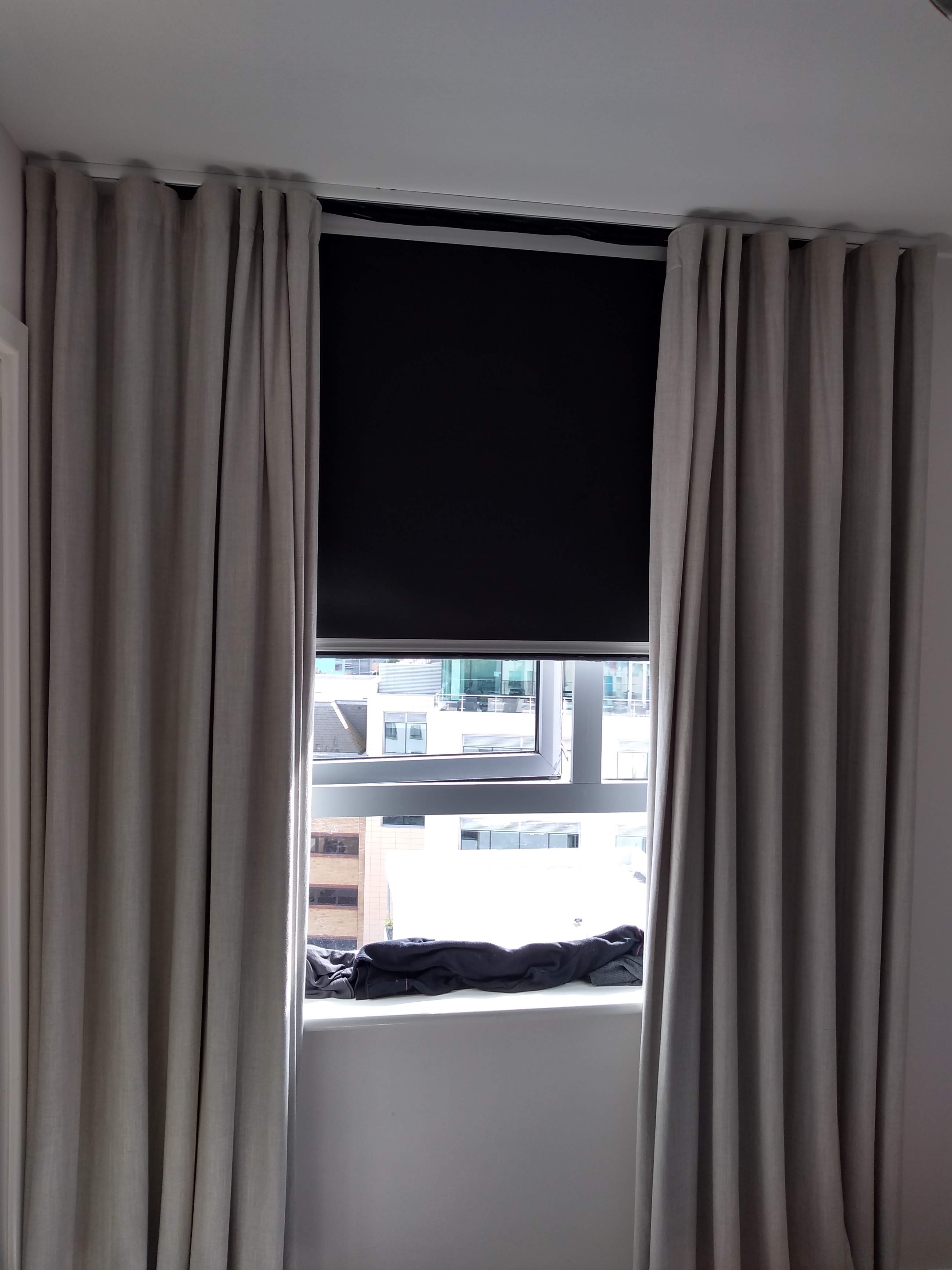 Blackout roller blind with drapery