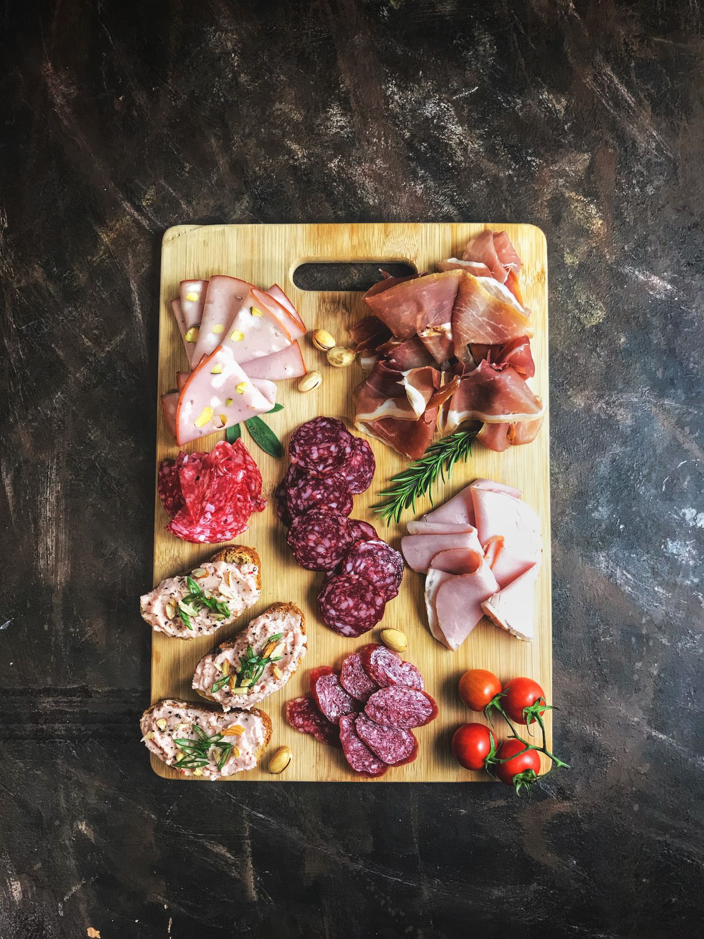 Assortment of fresh and cured cuts on a board