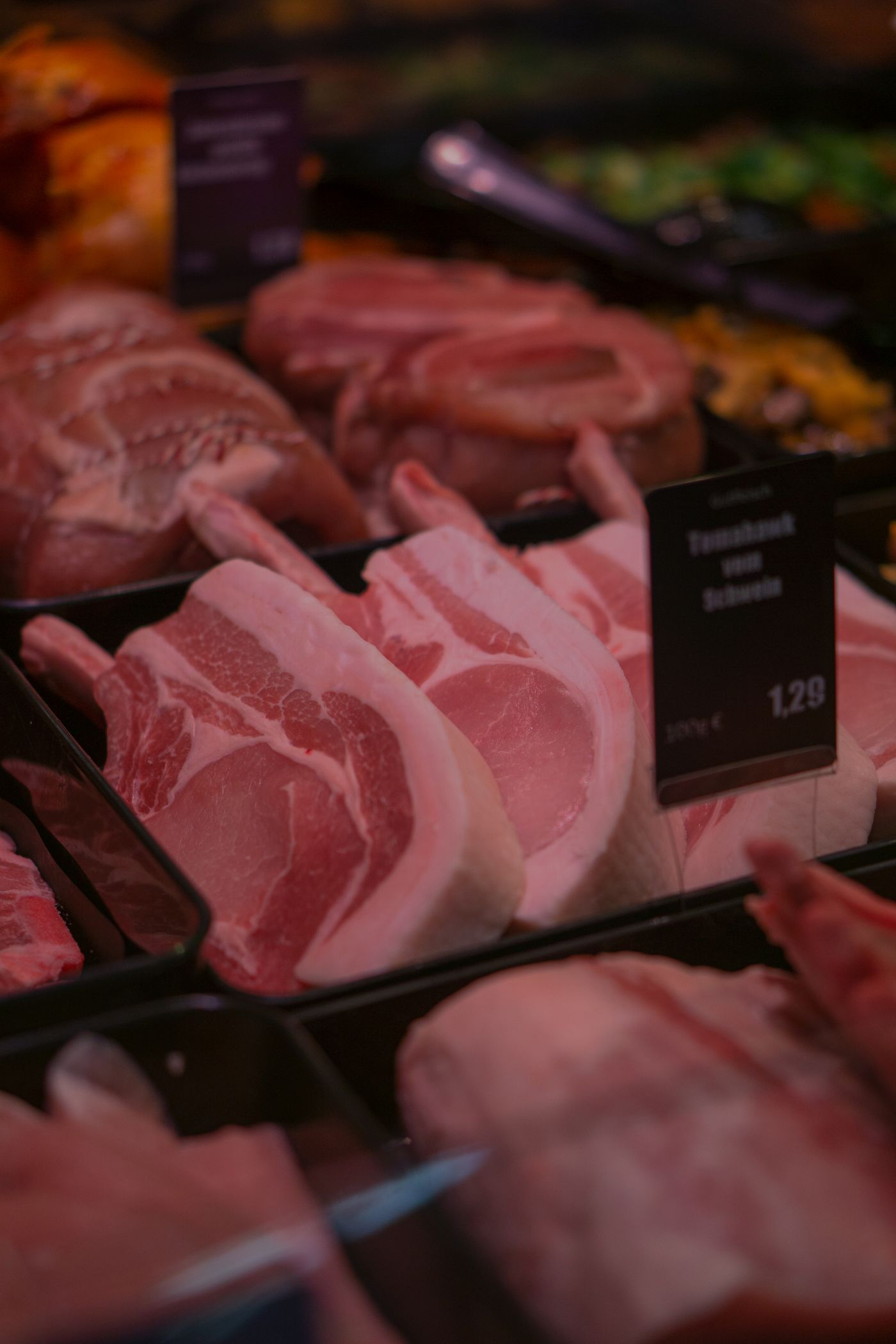 Fresh raw pork chops in the case
