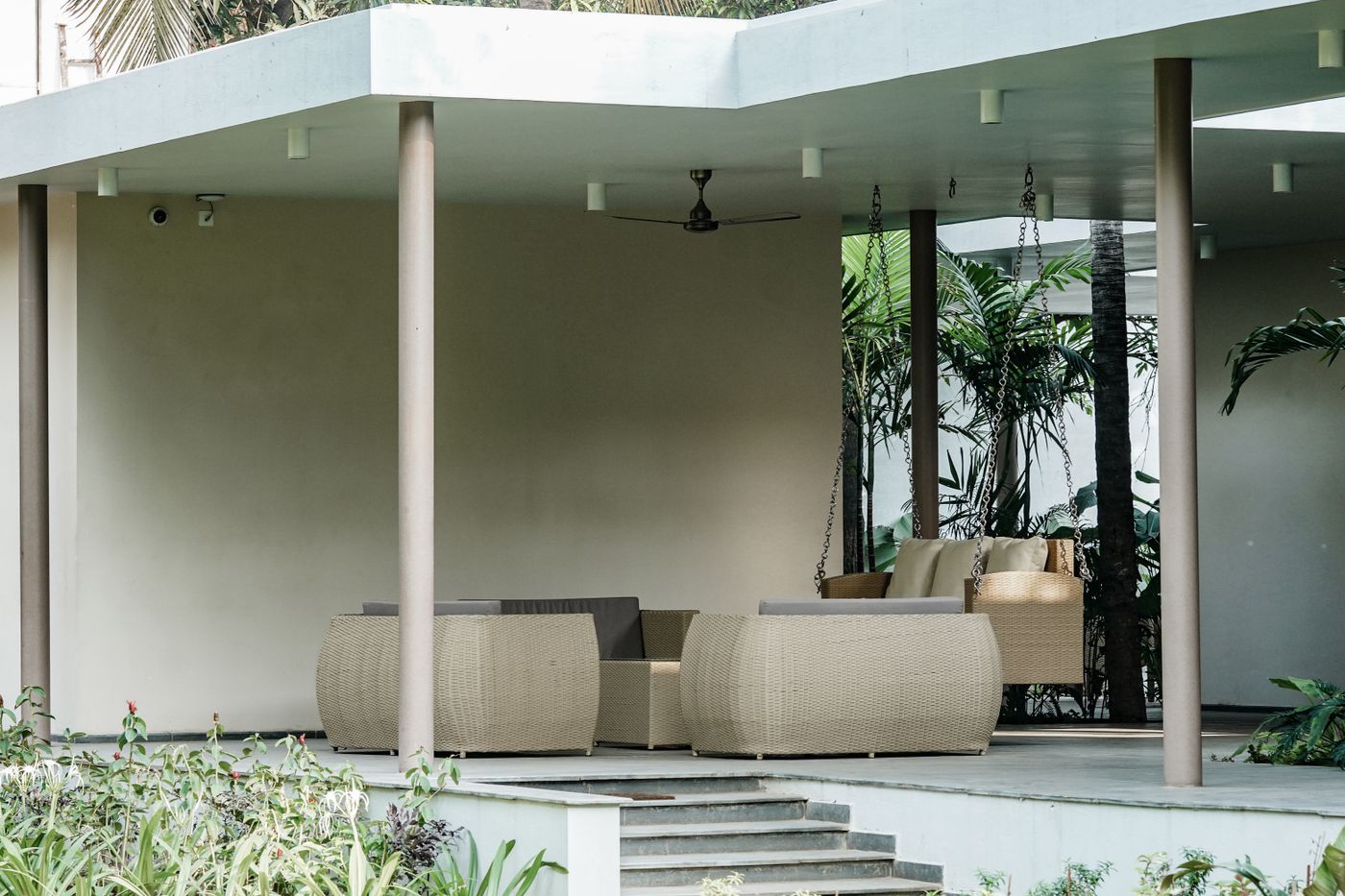 Covered patio with columns and outdoor lounge seating