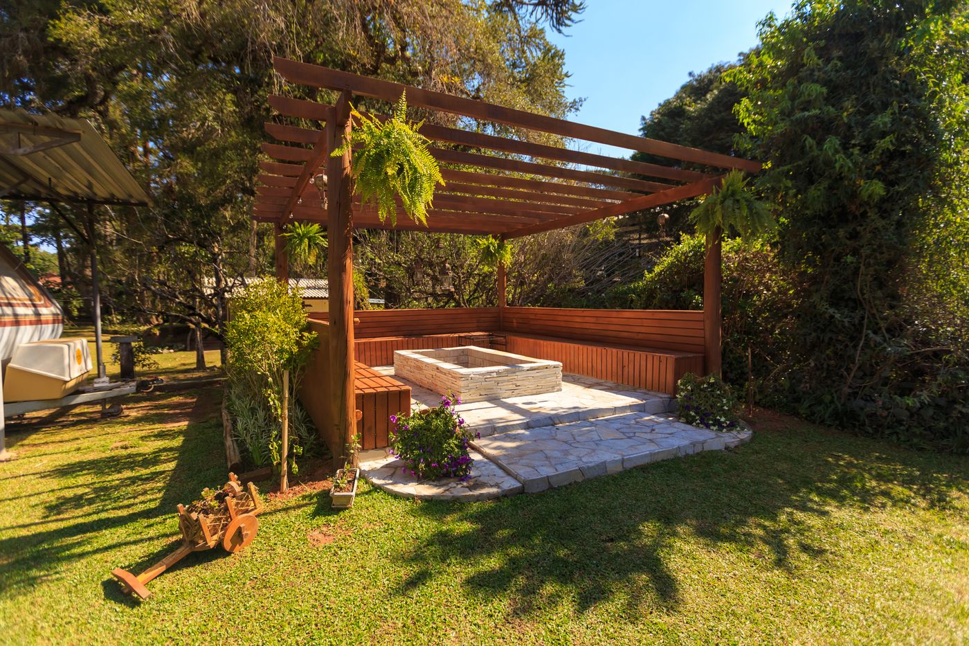 Wooden pergola over a stone patio