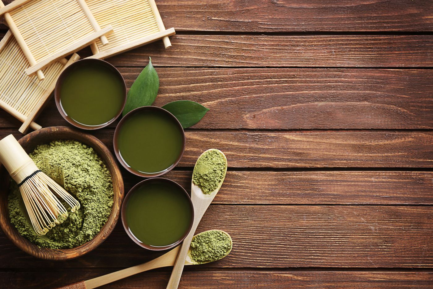 Matcha, a bamboo whisk and small bowls