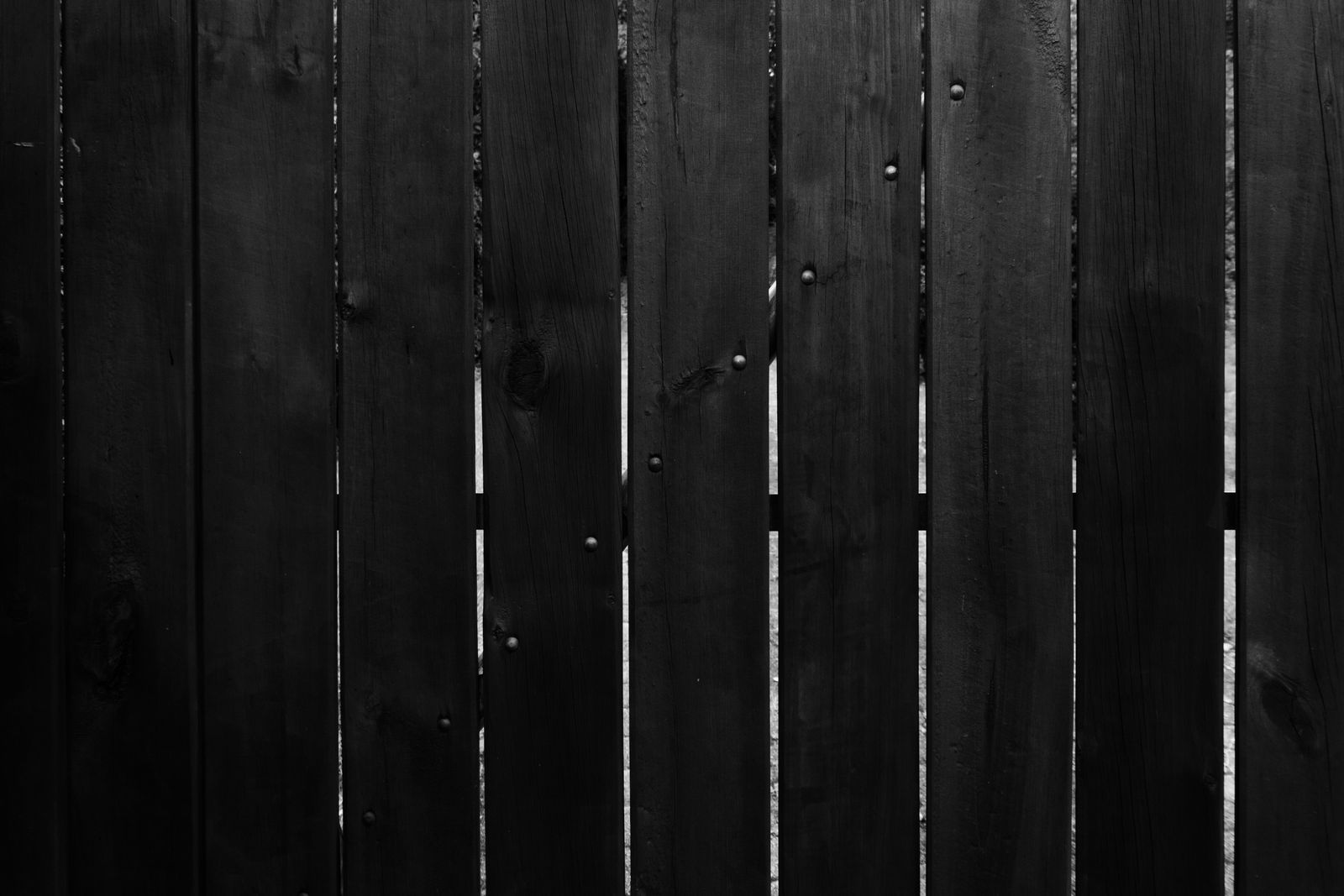 Dark stained cedar fence boards