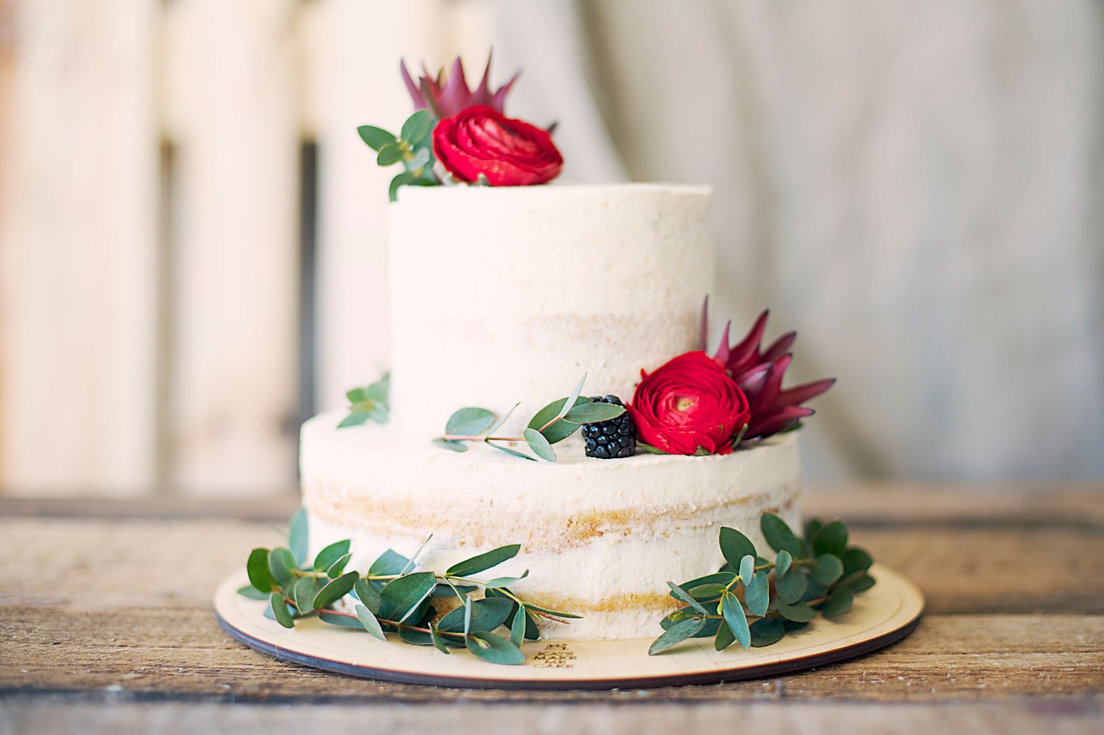 Tiered celebration cake finished with fresh berries