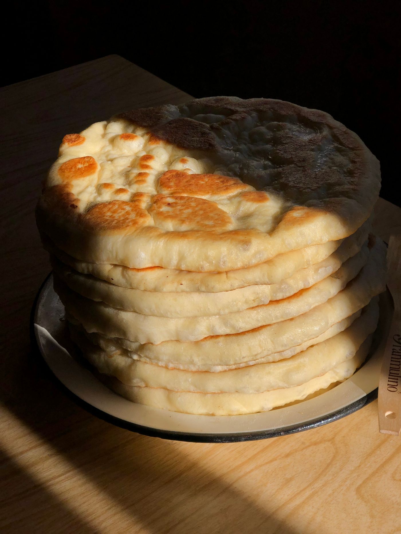 Stack of fresh flatbread in sunlight