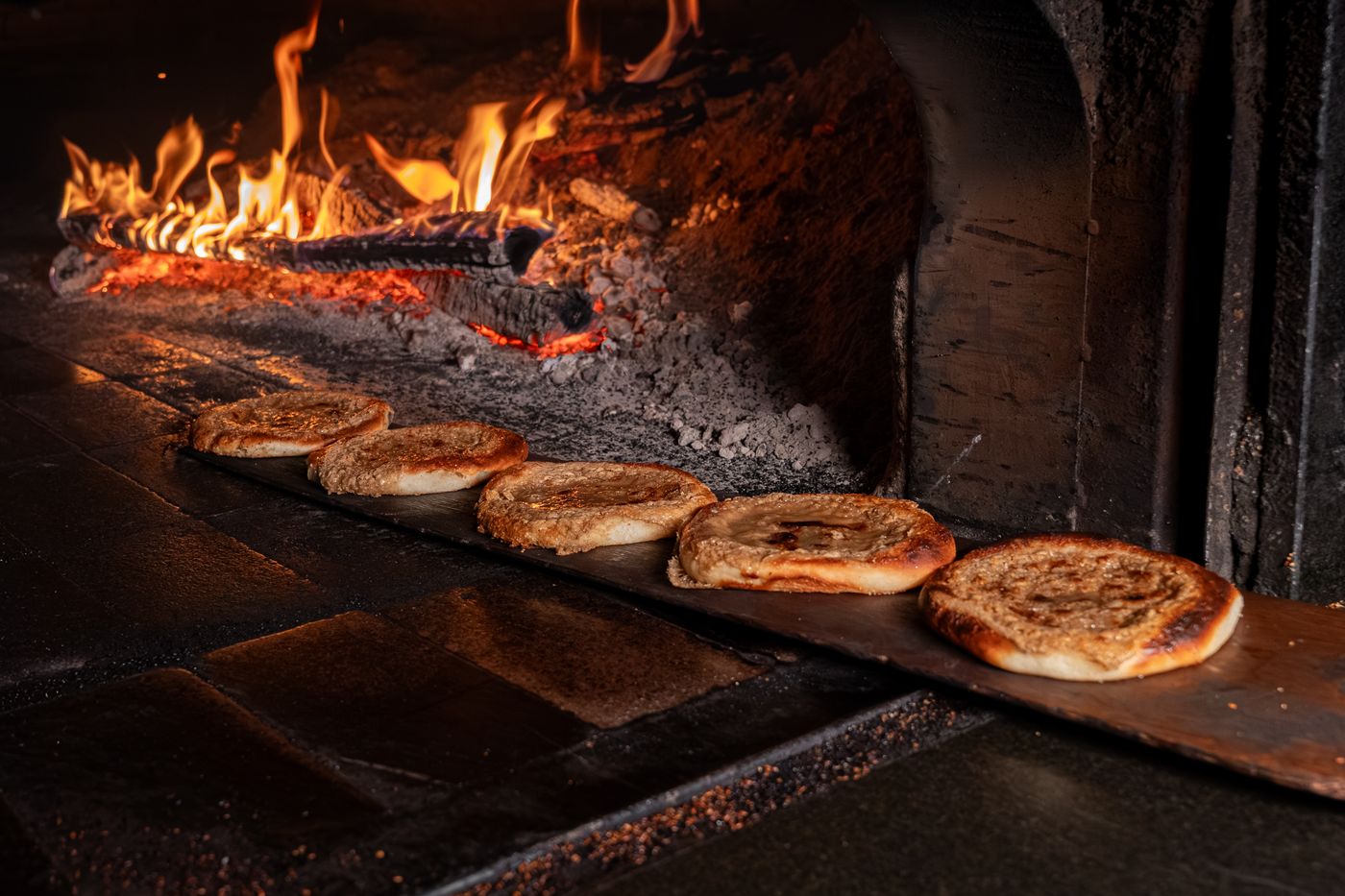 Flatbread baking in a wood-fired oven
