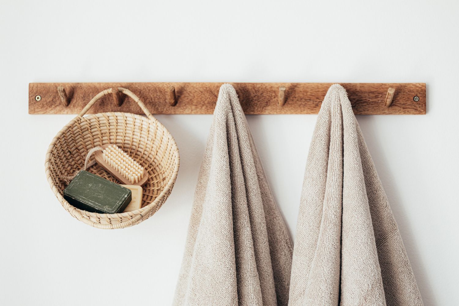 Rolled fresh towels on a shelf