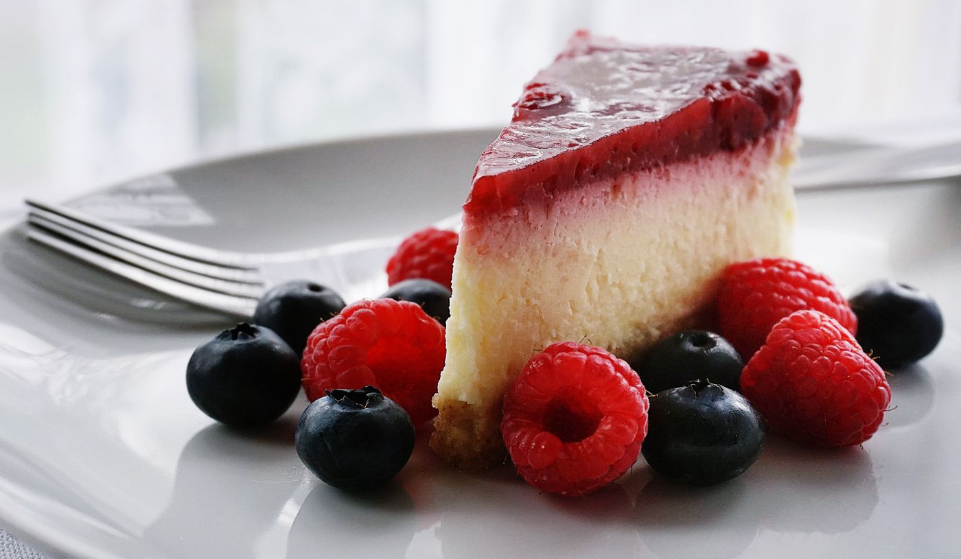 A berry-topped slice with fresh fruit