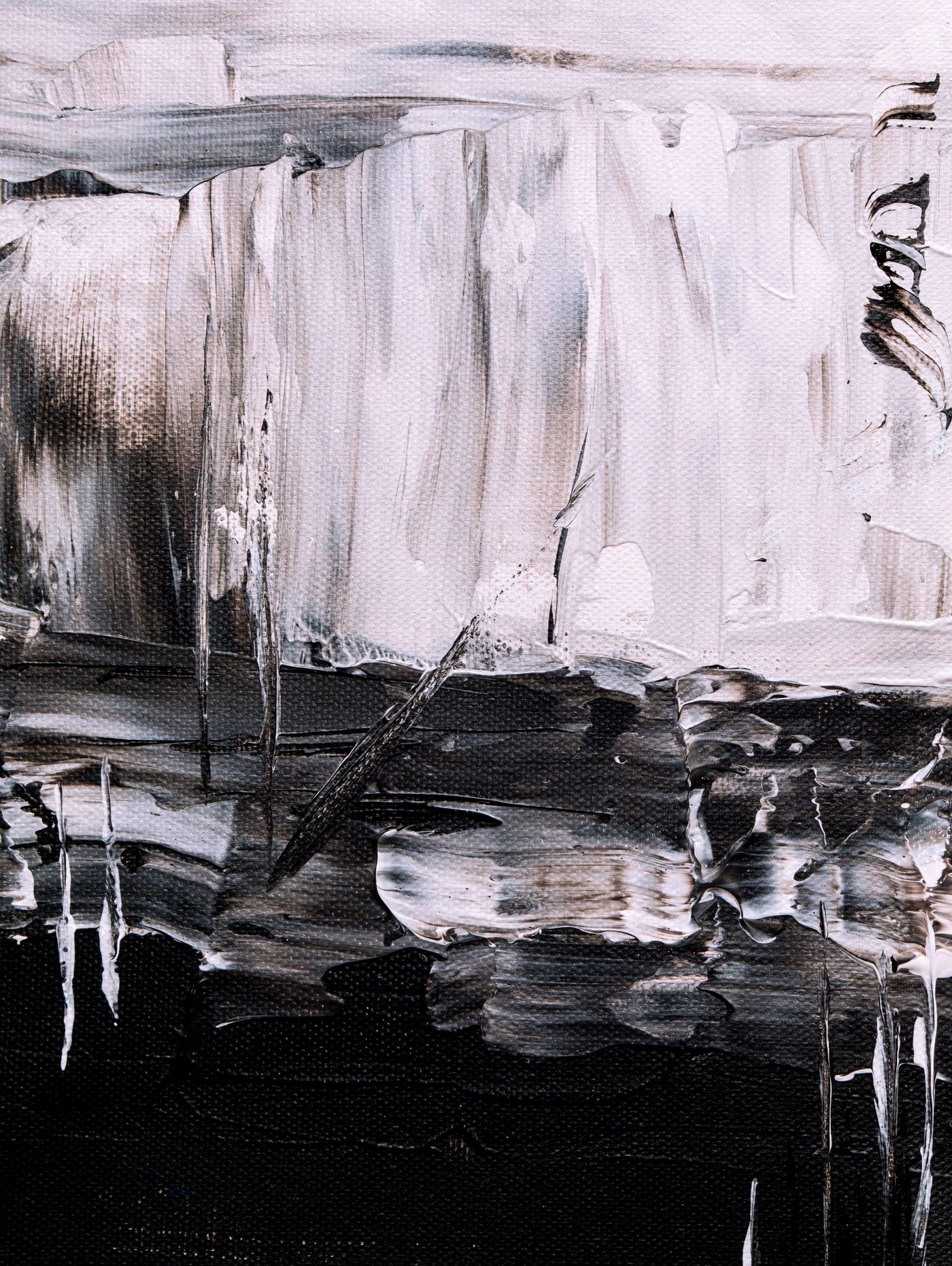 A bold textured painting hung as the feature piece