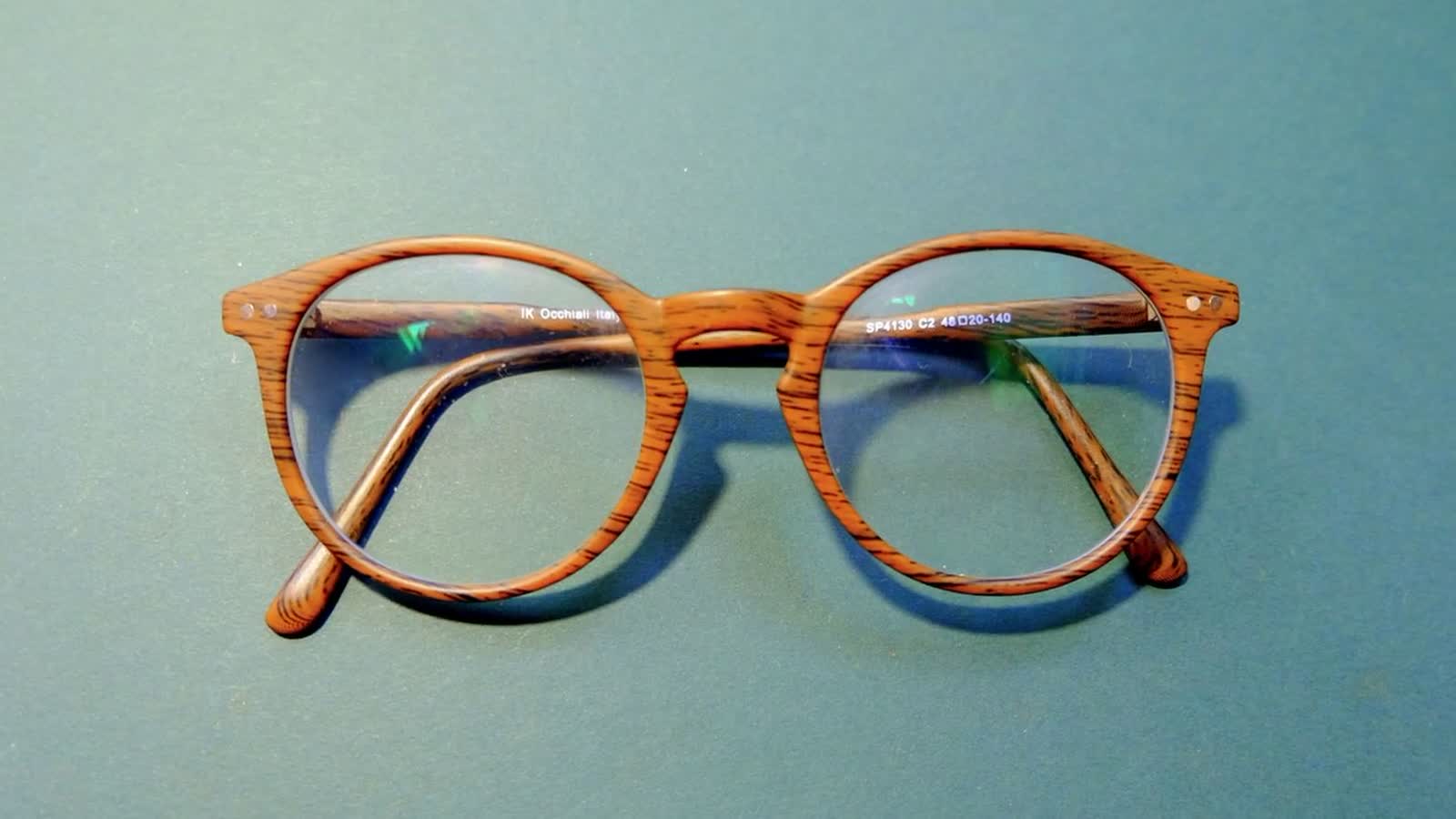 A warm flat-lay of eyeglass frames