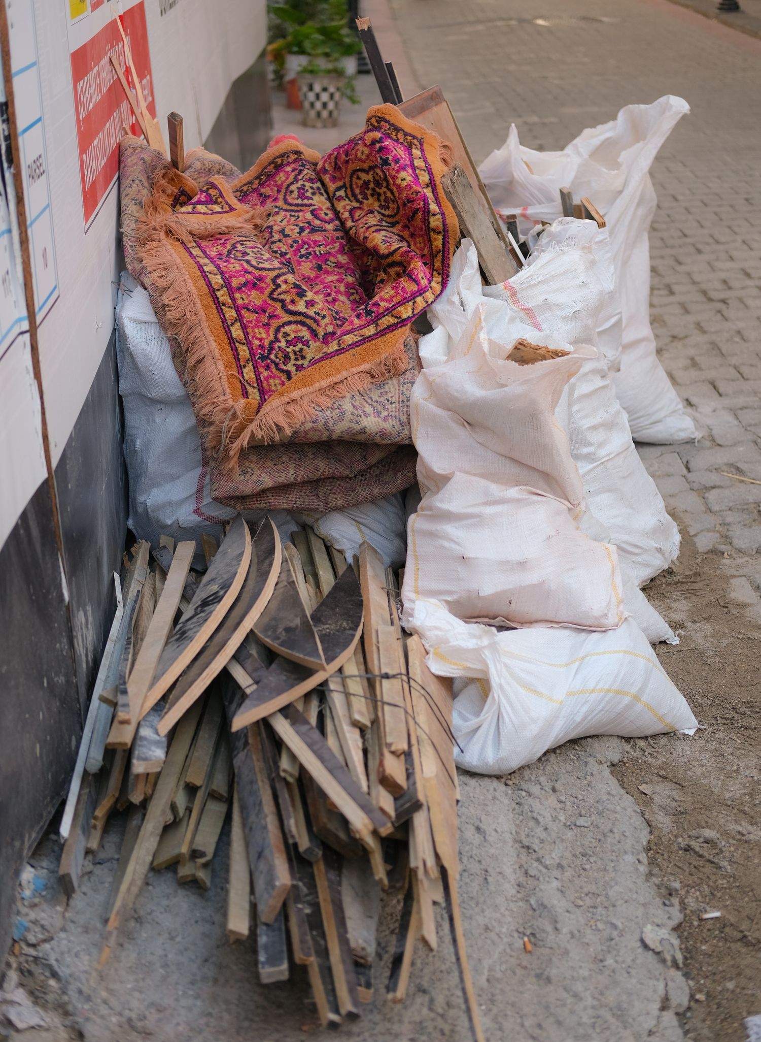 Stacked wood and bagged debris