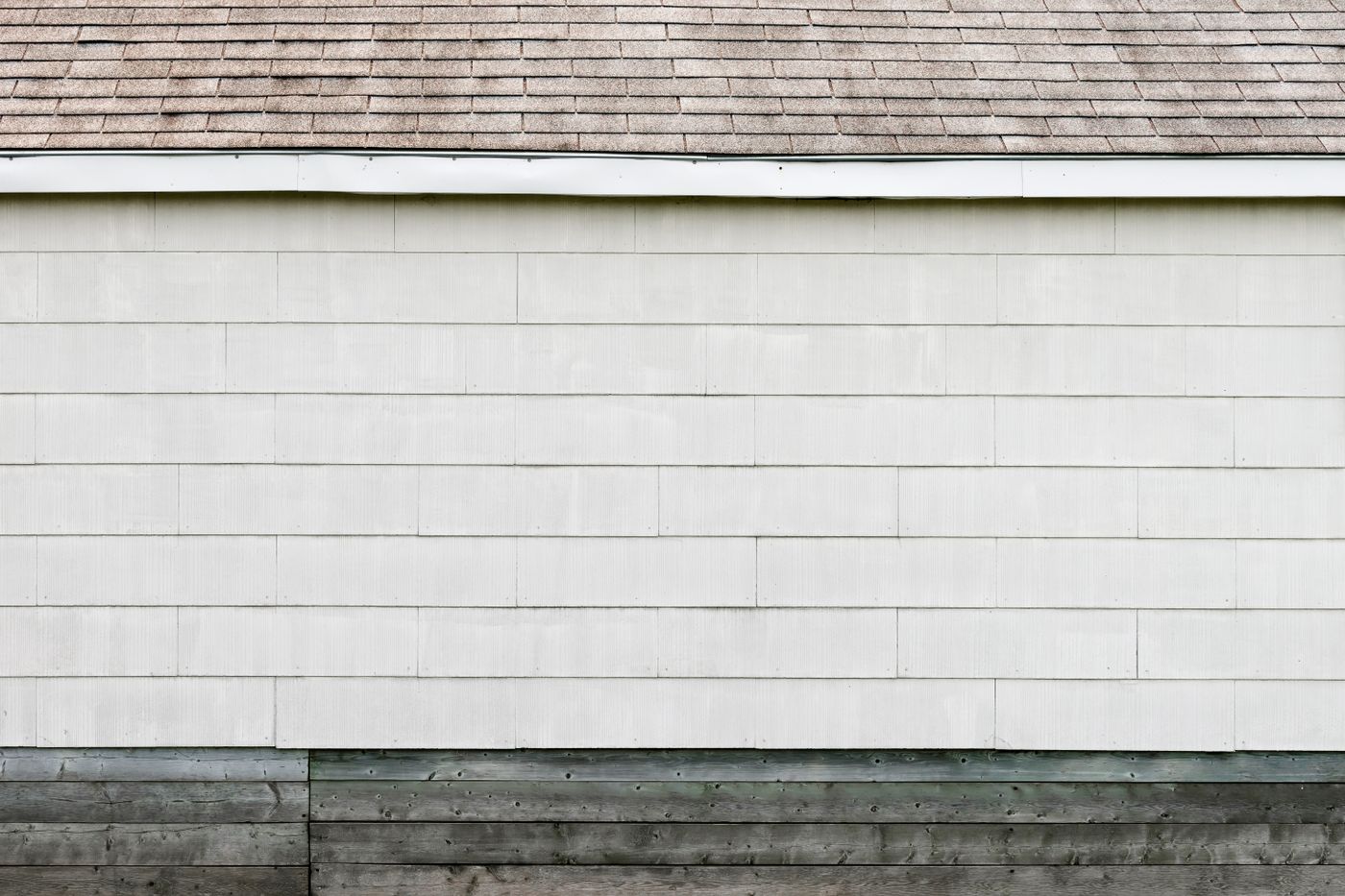 Clean white house siding after a soft-wash