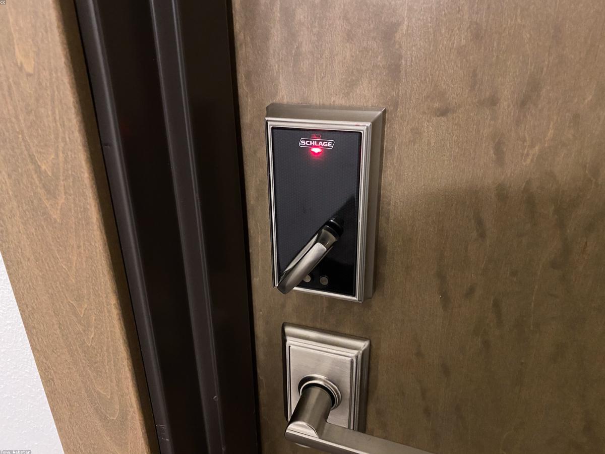 A smart deadbolt and keyed lever on a door