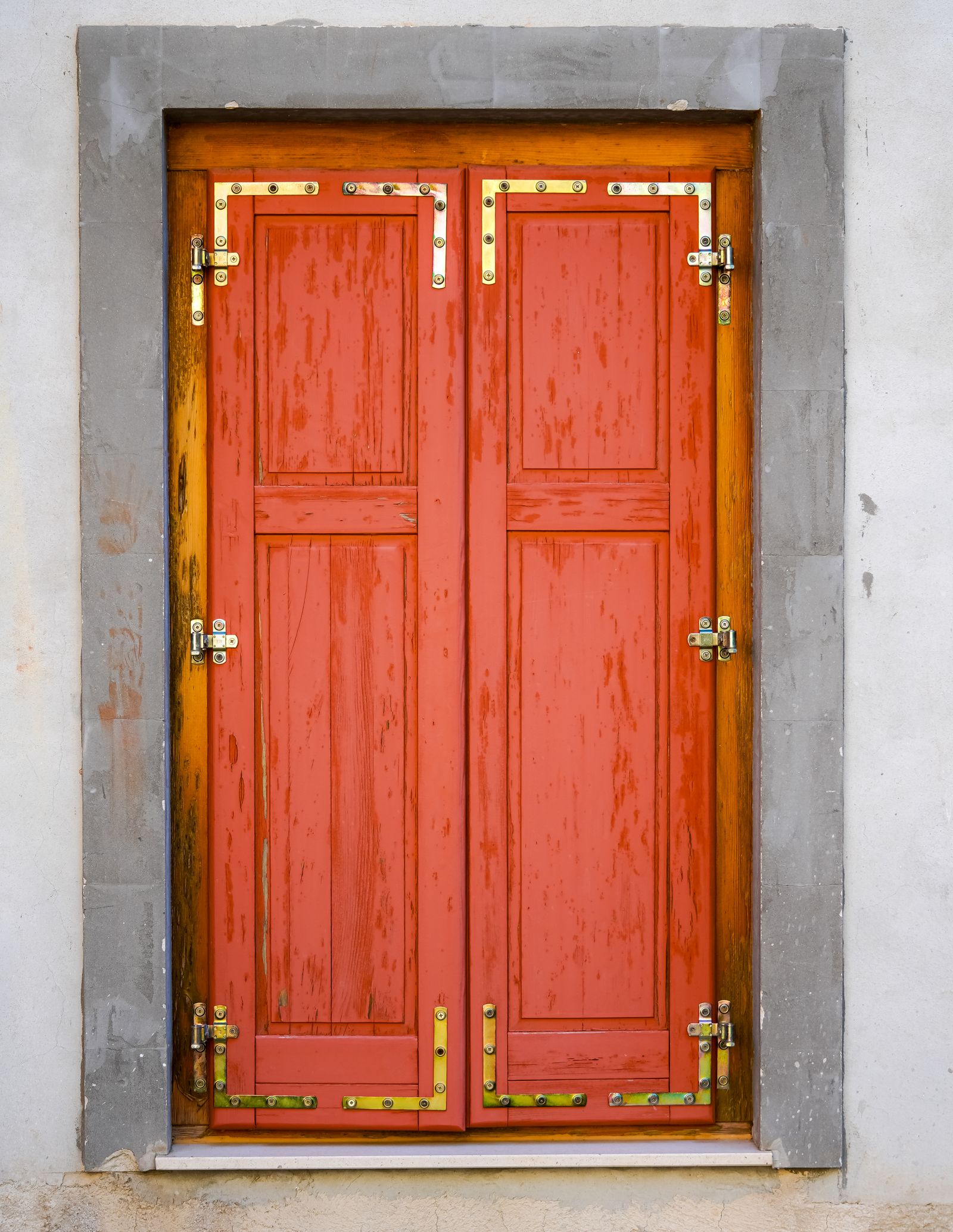 A red door with brass lock hardware