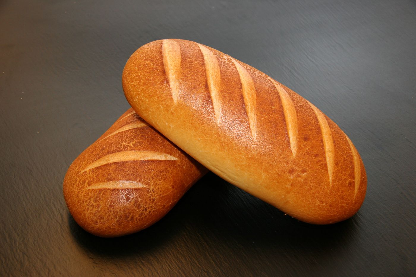 Crusty baguettes laid out, fresh from the oven