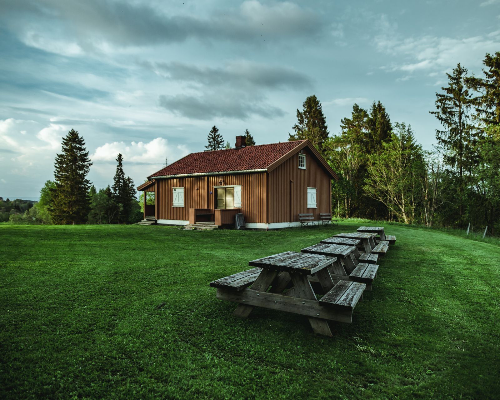 A home standing under a grey, rain-heavy sky
